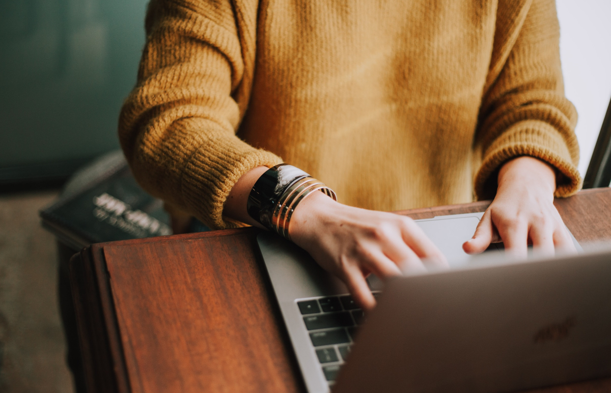 Photo of someone typing on a computer