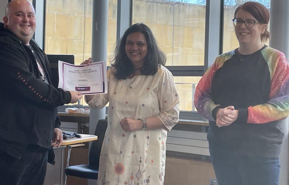 Rob Robinson receives the Yuan Changing Prize from Drs Radhika Govinda and Meryl Kenny.