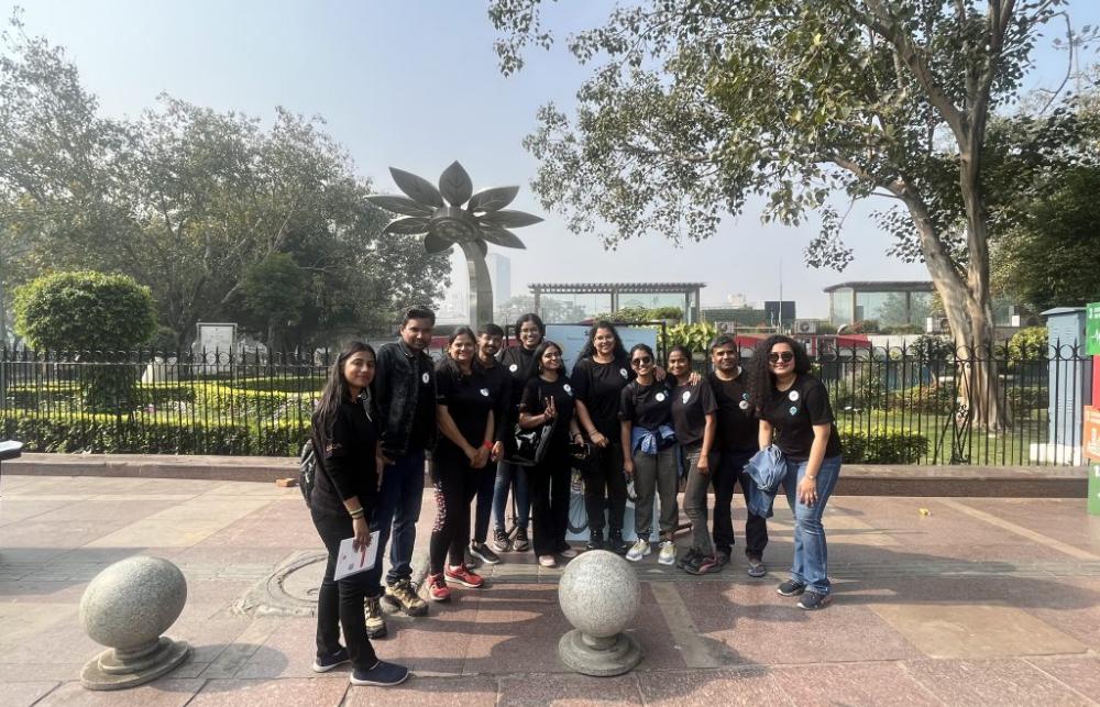 The team at Safetipin (11 people) standing in a semicircle and smiling at the camera