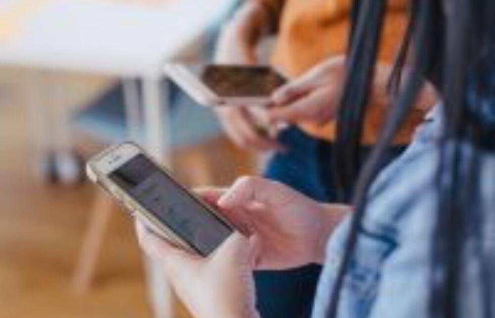 Image: People on their phones