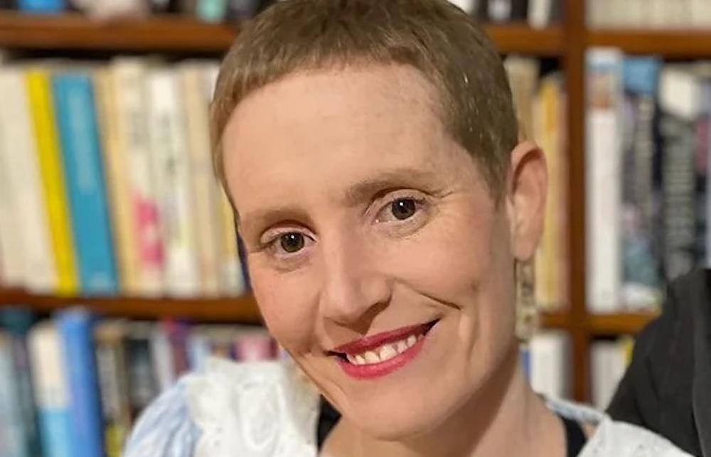 Rosa featured here with a close crop of hair and a smile