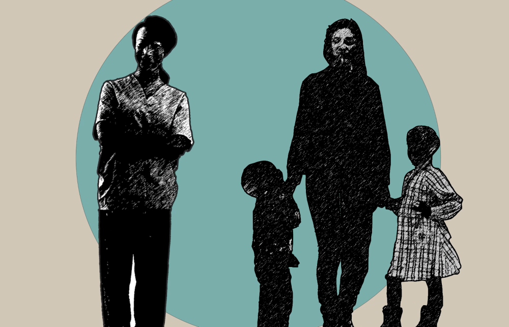 On the left side of the photo, a woman is standing with her arms crossed.  On the  right side, a woman is standing and smiling. In each of her hands, she is holding the hand of a child. All people in the photo are covered by shadows, so it is difficult to tell their exact facial expressions. 